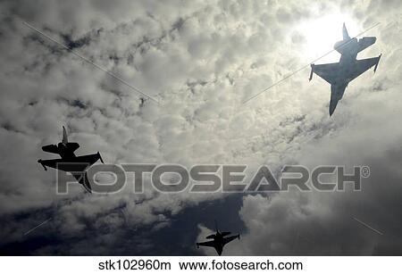 Three F-16 Fighting Falcons fly in formation over Guam. View Large Photo Image Picture - Three F-16 Fighting Falcons fly in formation over Guam.. Fotosearch