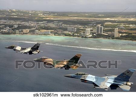 Picture - Three F-16 Fighting Falcons fly in formation over Tumon Bay, Guam.. Fotosearch