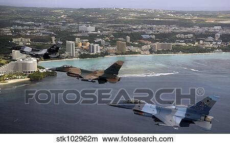 Three F-16 Fighting Falcons fly in formation over Tumon Bay, Guam. View Large Photo Image Picture - Three F-16 Fighting Falcons fly in formation over Tumon Bay, Guam.. Fotosearch