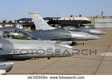 Three F-16 Fighting Falcons prepare to taxi for departure. View Large Photo Image Picture - Three F-16 Fighting Falcons prepare to taxi for departure.. Fotosearch