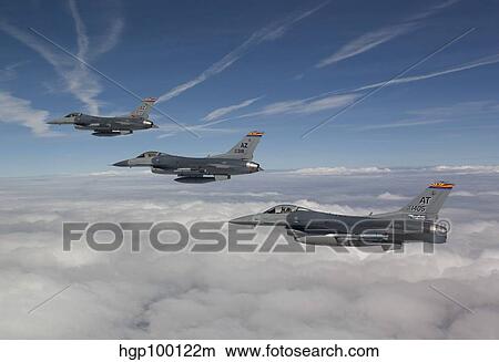 Three F-16's fly in formation during a training mission over Arizona. View Large Photo Image Picture - Three F-16's fly in formation during a training mission over Arizona.. Fotosearch