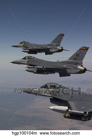 Three F-16's fly in formation over Arizona. View Large Photo Image Picture - Three F-16's fly in formation over Arizona.. Fotosearch