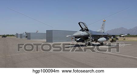 Three F-16's sit in the revetments at Davis-Monthan Air Force Base. View Large Photo Image Picture - Three F-16's sit in the revetments at Davis-Monthan Air Force Base.. Fotosearch