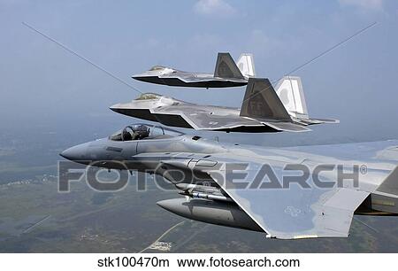 Three F/A-22 Raptors fly in formation during a training sortie. View Large Photo Image Picture - Three F/A-22 Raptors fly in formation during a training sortie.. Fotosearch