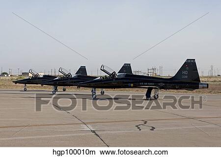 Three T-38's sit at the end of the runway for preflight checks. View Large Photo Image Picture - Three T-38's sit at the end of the runway for preflight checks.. Fotosearch