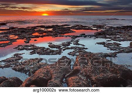 Tidal pools reflect the sunrise colors during the autumn equinox. View Large Photo Image Stock Photograph - Tidal pools reflect the sunrise colors during the autumn equinox.. Fotosearch