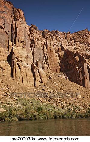 Tourist peak over the edge of a high cliff at Horseshoe bend, Arizona. View Large Photo Image Stock Photograph - Tourist peak over the edge of a high cliff at Horseshoe bend, Arizona.. Fotosearch