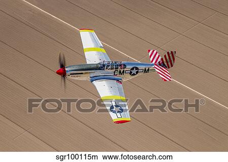 TP-51C Mustang over the central Arizona desert. View Large Photo Image Picture - TP-51C Mustang over the central Arizona desert.. Fotosearch
