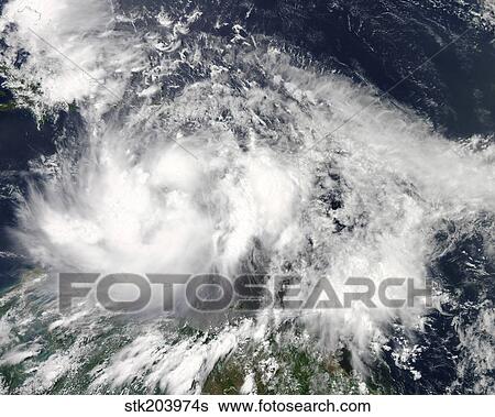 Stock Photograph - Tropical Storm Isaac hovers over the Caribbean Sea.. Fotosearch