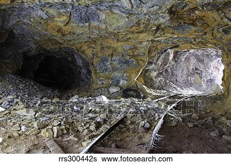 Tunnel with abandoned railtracks at historic sulfur mine, Milos, Greece. View Large Photo Image Stock Photograph - Tunnel with abandoned railtracks at historic sulfur mine, Milos, Greece.. Fotosearch
