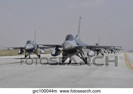 Turkish Air Force F-16C/D aircraft taxiing on the runway. View Large Photo Image Picture - Turkish Air Force F-16C/D aircraft taxiing on the runway.. Fotosearch