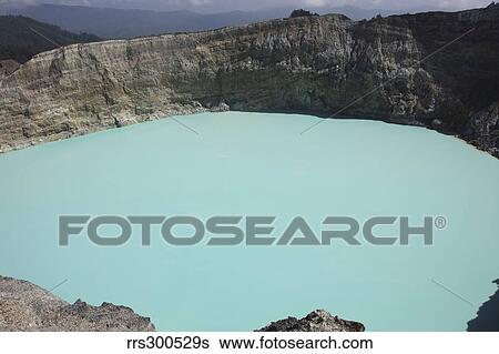 Turquoise crater lake of Kelimutu volcano, Flores Island, Indonesia. View Large Photo Image Stock Photograph - Turquoise crater lake of Kelimutu volcano, Flores Island, Indonesia.. Fotosearch