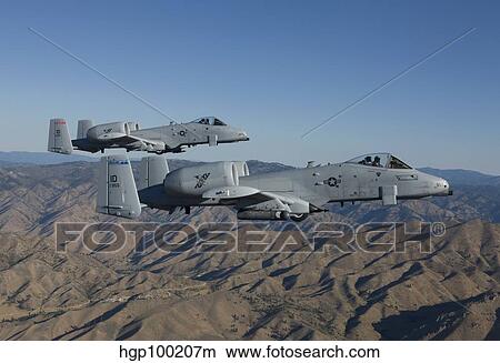 Two A-10 Thunderbolt's fly over Central Idaho. View Large Photo Image Picture - Two A-10 Thunderbolt's fly over Central Idaho.. Fotosearch