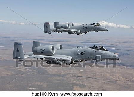 Two A-10 Thunderbolt's fly over the Saylor Creek bombing range, Idaho. View Large Photo Image Picture - Two A-10 Thunderbolt's fly over the Saylor Creek bombing range, Idaho.. Fotosearch