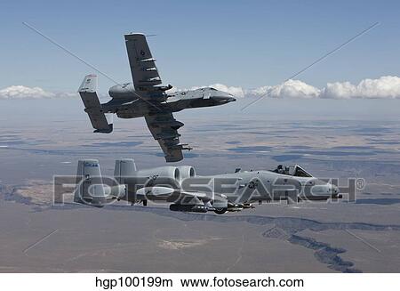 Two A-10 Thunderbolt's fly over the Saylor Creek bombing range, Idaho. View Large Photo Image Picture - Two A-10 Thunderbolt's fly over the Saylor Creek bombing range, Idaho.. Fotosearch