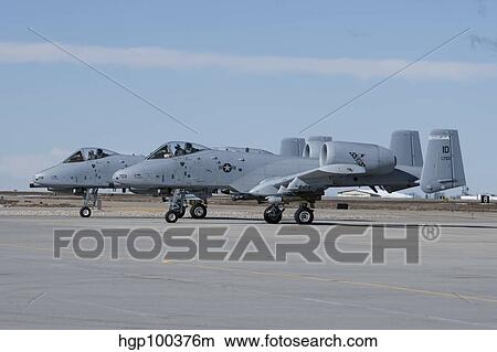Two A-10 Thunderbolt's prepare to taxi to the runway. View Large Photo Image Picture - Two A-10 Thunderbolt's prepare to taxi to the runway.. Fotosearch
