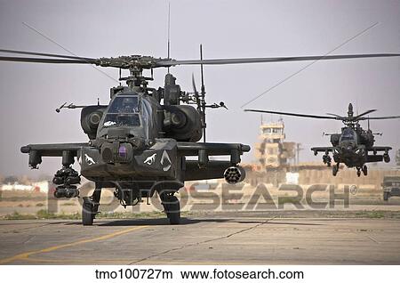 Two AH-64 Apache helicopters return from a mission over Iraq. View Large Photo Image Picture - Two AH-64 Apache helicopters return from a mission over Iraq.. Fotosearch