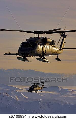 Two Alaska Air National Guard HH-60G Pave Hawks in flight over Alaska View Large Photo Image Picture - Two Alaska Air National Guard HH-60G Pave Hawks in flight over Alaska. Fotosearch
