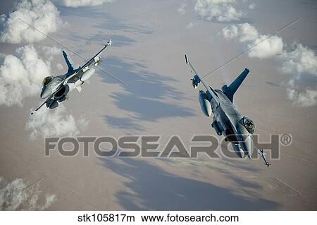 Picture - Two Belgian Air Component F-16A Falcons perform a split break.. Fotosearch