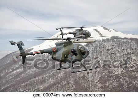 Two Breda Nardi NH-500 helicopters of the Italian Air Force over Frosinone, Italy. View Large Photo Image Picture - Two Breda Nardi NH-500 helicopters of the Italian Air Force over Frosinone, Italy.. Fotosearch