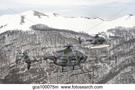 Two Breda Nardi NH-500 helicopters of the Italian Air Force over Frosinone, Italy. View Large Photo Image Picture - Two Breda Nardi NH-500 helicopters of the Italian Air Force over Frosinone, Italy.. Fotosearch