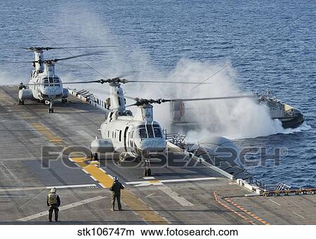 Two CH-46E Sea Knight helicopters on the flight deck of USS Bonhomme Richard. View Large Photo Image Picture - Two CH-46E Sea Knight helicopters on the flight deck of USS Bonhomme Richard.. Fotosearch
