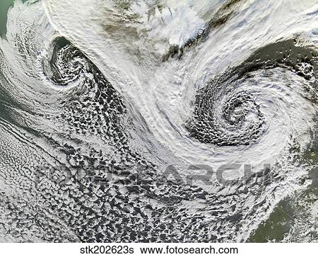 Two cyclones formed in tandem south of Iceland. Scotland appears in the lower right. View Large Photo Image Stock Photograph - Two cyclones formed in tandem south of Iceland. Scotland appears in the lower right.. Fotosearch