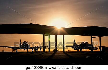 Two Embraer A-29 Super Tucano aircraft parked in the hangar at Natal Air Force Base, Brazil View Large Photo Image Picture - Two Embraer A-29 Super Tucano aircraft parked in the hangar at Natal Air Force Base, Brazil. Fotosearch