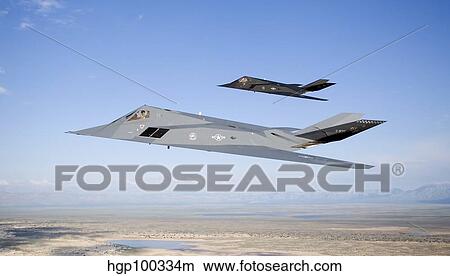 Two F-117 Nighthawk stealth fighters in flight over New Mexico. View Large Photo Image Picture - Two F-117 Nighthawk stealth fighters in flight over New Mexico.. Fotosearch