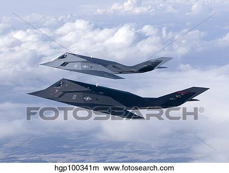 Two F-117 Nighthawk stealth fighters in flight over New Mexico. View Large Photo Image Picture - Two F-117 Nighthawk stealth fighters in flight over New Mexico.. Fotosearch