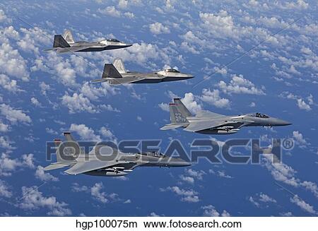 Two F-15 Eagles and F-22 Raptors fly in formation. View Large Photo Image Picture - Two F-15 Eagles and F-22 Raptors fly in formation.. Fotosearch