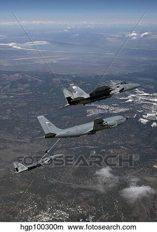 Two F-15 Eagles conduct aerial refueling with a KC-135 Stratotanker. View Large Photo Image Picture - Two F-15 Eagles conduct aerial refueling with a KC-135 Stratotanker.. Fotosearch