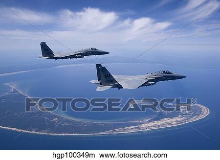 Two F-15 Eagles fly high over Cape Cod, Massachusetts. View Large Photo Image Picture - Two F-15 Eagles fly high over Cape Cod, Massachusetts.. Fotosearch