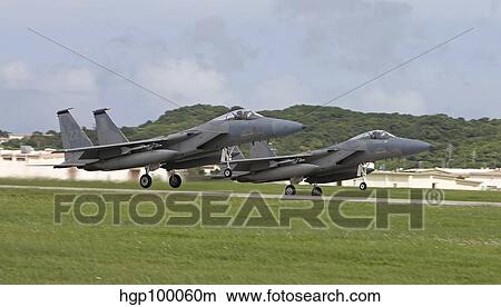 Two F-15 Eagle's take off in formation from Kadena Air Base, Japan. View Large Photo Image Picture - Two F-15 Eagle's take off in formation from Kadena Air Base, Japan.. Fotosearch