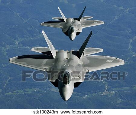 Two F-15's fly in formation behind a KC-10 Extender. View Large Photo Image Picture - Two F-15's fly in formation behind a KC-10 Extender.. Fotosearch