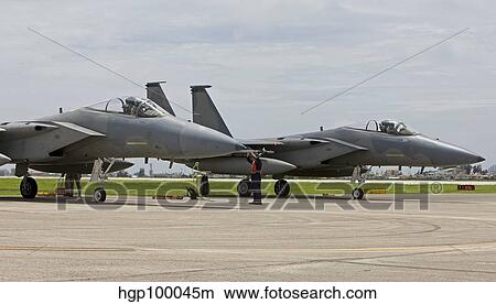 Two F-15's parked at the end of runway at Kadena Air Base, Japan. View Large Photo Image Picture - Two F-15's parked at the end of runway at Kadena Air Base, Japan.. Fotosearch