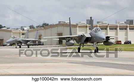 Two F-15's taxi to the End of Runway at Kadena Air Base, Japan. View Large Photo Image Picture - Two F-15's taxi to the End of Runway at Kadena Air Base, Japan.. Fotosearch