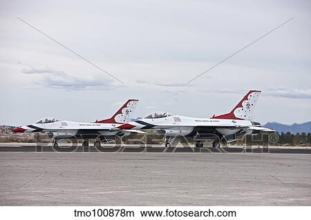 Two F-16C Thunderbirds sit on the runway at Nellis Air Force Base, Nevada. View Large Photo Image Picture - Two F-16C Thunderbirds sit on the runway at Nellis Air Force Base, Nevada.. Fotosearch