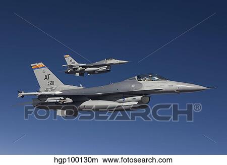 Two F-16's fly in formation over Arizona. View Large Photo Image Picture - Two F-16's fly in formation over Arizona.. Fotosearch