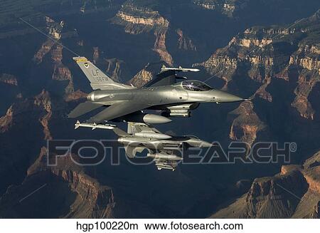 Picture - Two F-16's fly in formation over the Grand Canyon, Arizona.. Fotosearch