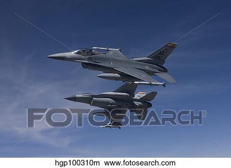 Picture - Two F-16's manuever on an air-to-air training mission.. Fotosearch