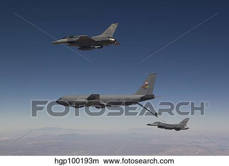 Two F-16's prepare to refuel from a KC-135 Stratotanker. View Large Photo Image Picture - Two F-16's prepare to refuel from a KC-135 Stratotanker.. Fotosearch