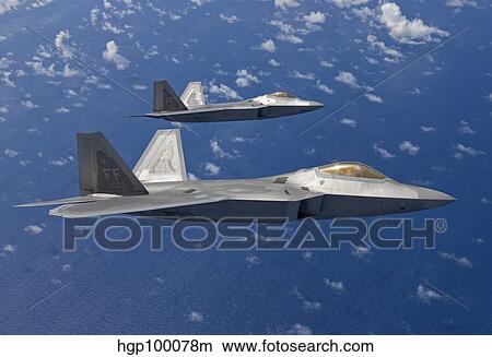 Picture - Two F-22 Raptors fly in formaton during a training mission.. Fotosearch