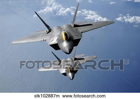 Picture - Two F-22 Raptors fly over the Pacific Ocean.. Fotosearch