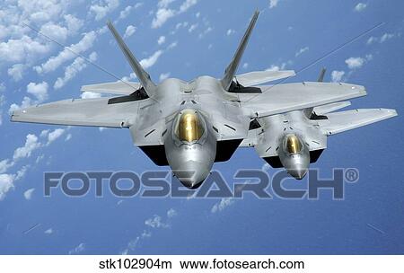Two F-22 Raptors fly over the Pacific Ocean. View Large Photo Image Picture - Two F-22 Raptors fly over the Pacific Ocean.. Fotosearch