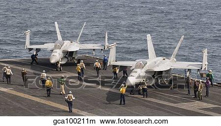 Two F/A-18 Super Hornet aircraft on the flight deck of USS George H. W. Bush. View Large Photo Image Picture - Two F/A-18 Super Hornet aircraft on the flight deck of USS George H. W. Bush.. Fotosearch