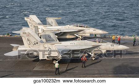 Two F/A-18 Super Hornet aircraft on the flight deck of USS George H. W. Bush. View Large Photo Image Picture - Two F/A-18 Super Hornet aircraft on the flight deck of USS George H. W. Bush.. Fotosearch