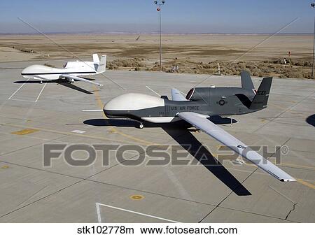 Two Global Hawks parked on a ramp. View Large Photo Image Picture - Two Global Hawks parked on a ramp.. Fotosearch