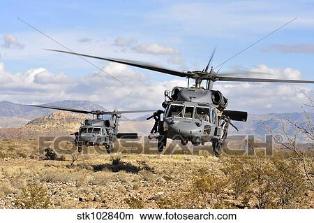 Two HH-60 Pavehawk helicopters preparing to land. View Large Photo Image Picture - Two HH-60 Pavehawk helicopters preparing to land.. Fotosearch