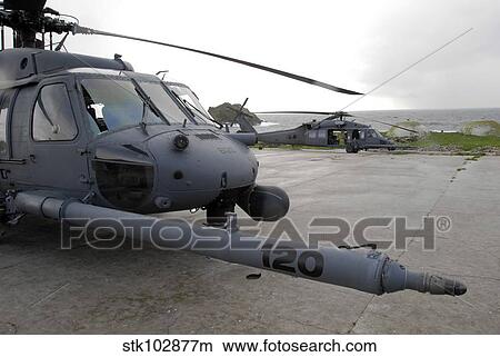 Two HH-60G Pave Hawks sit at a helipad at Farallon Island. View Large Photo Image Picture - Two HH-60G Pave Hawks sit at a helipad at Farallon Island.. Fotosearch